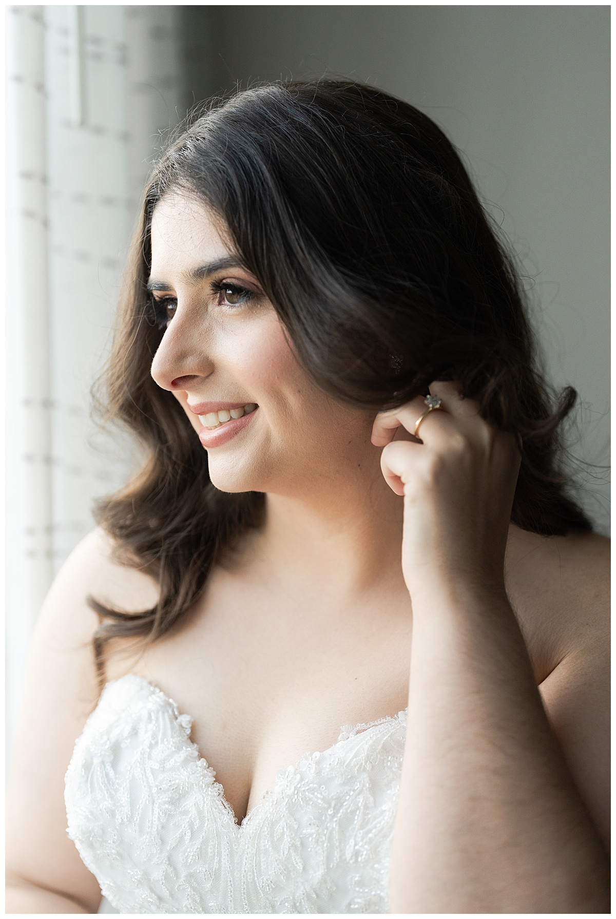 Sweet moment of bride looking out the window photographed by Swish & Click Photography