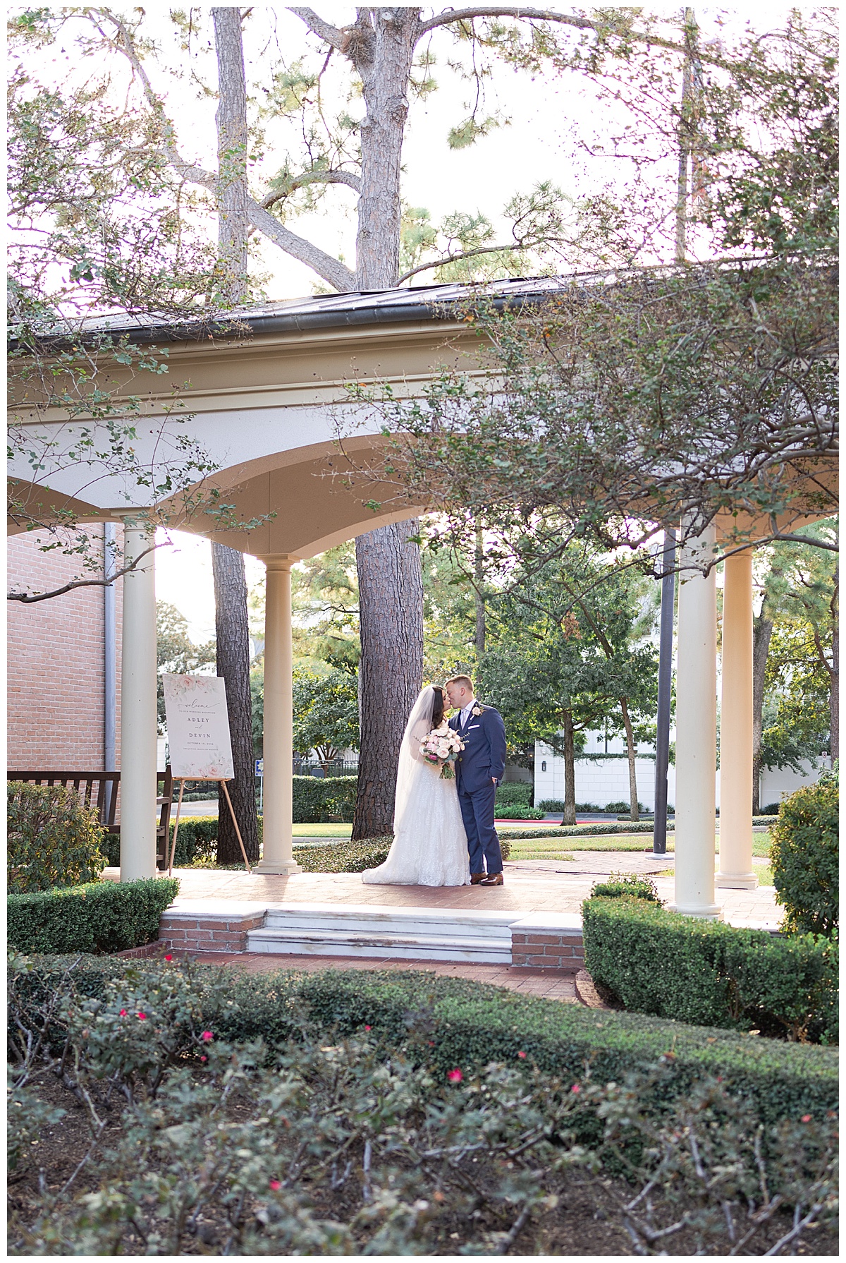 Bride and groom kissing at wedding venue photographed by Swish & Click Photography