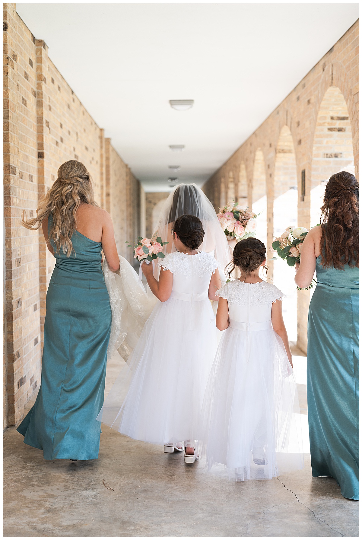 Candid moment of bride and bridal party photographed by Swish & Click Photography