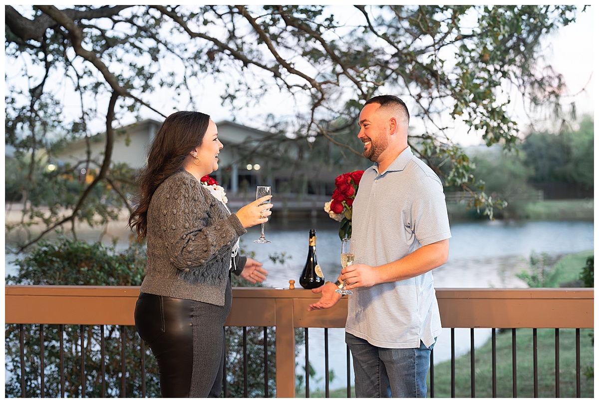 Couple enjoying champagne after engagement