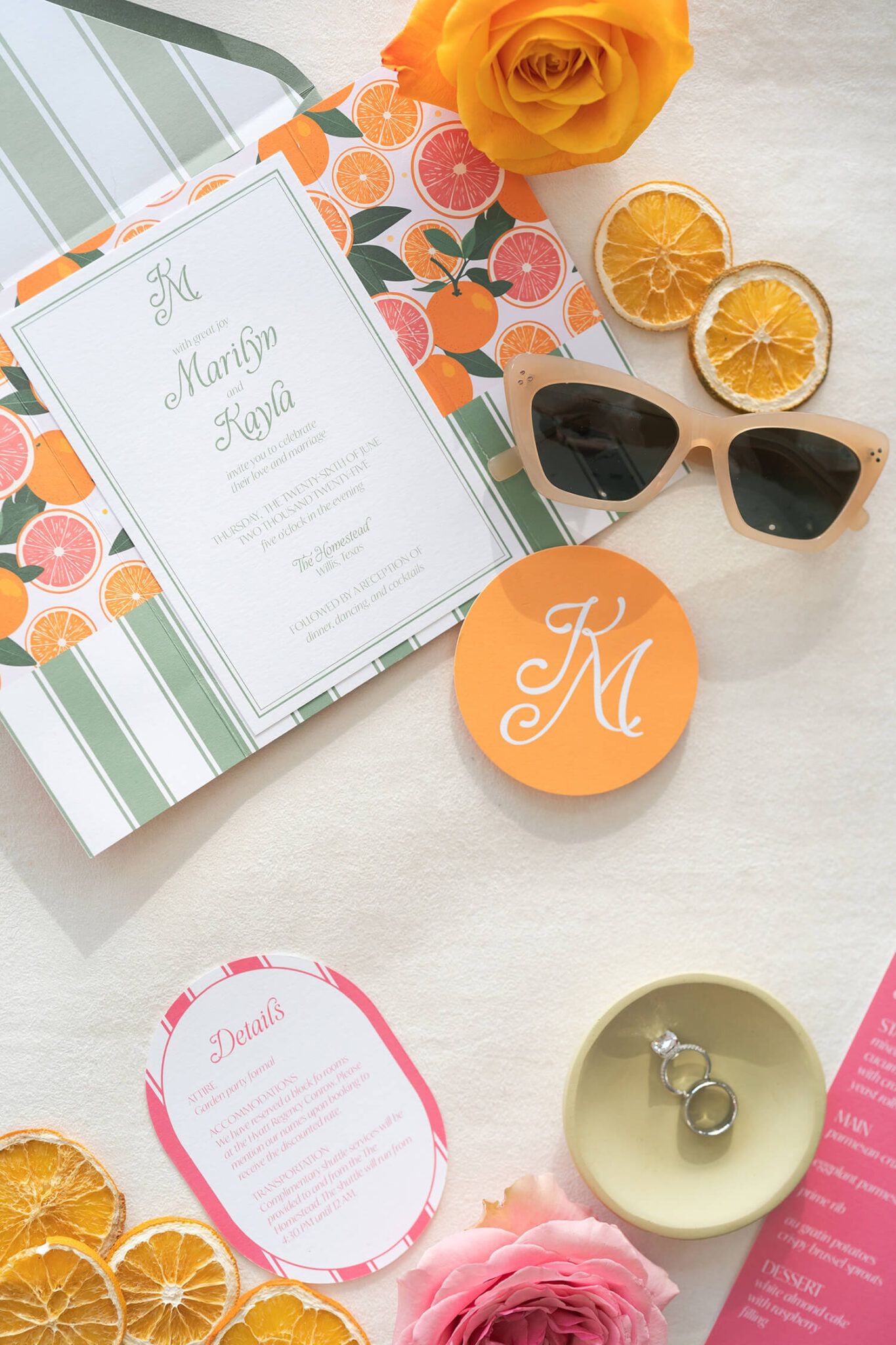 invitation suite in bold stripes sits on a styling mat on a wedding day