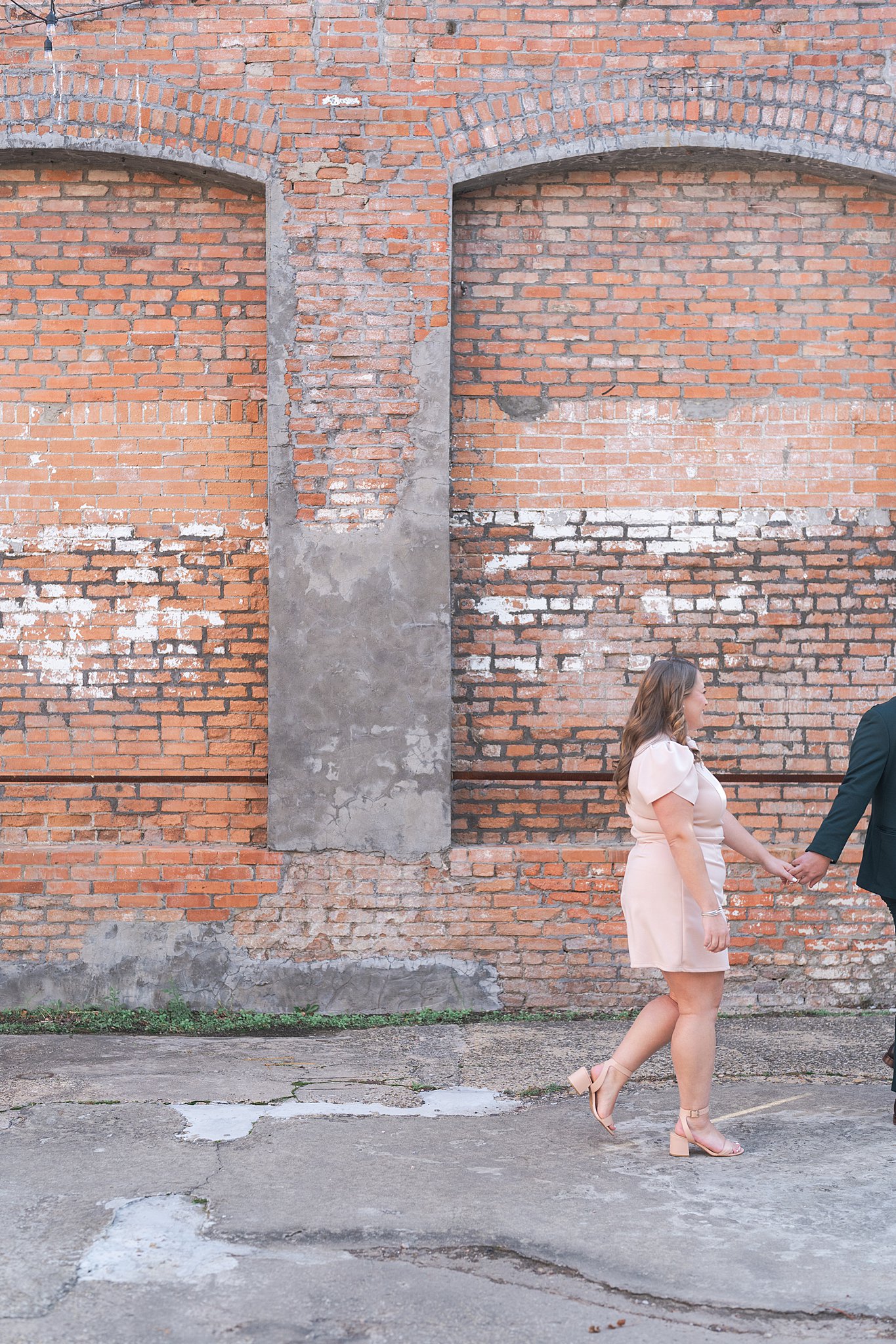 engaged couple stroll during their Dallas engagement session with Swish and Click Photography