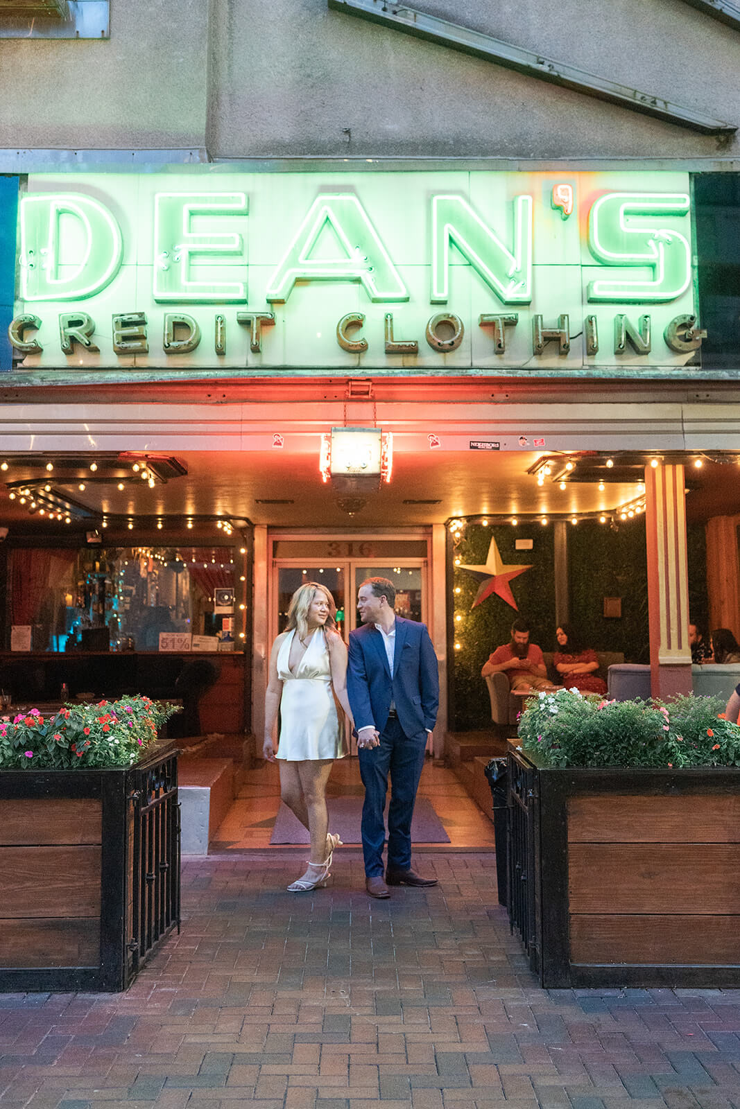 couple pose during their engagement session in downtown Houston by Swish and Click Photography