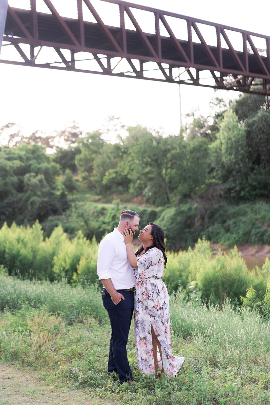 couple kiss during their engagement session in midtown Houston by Swish and Click Photography