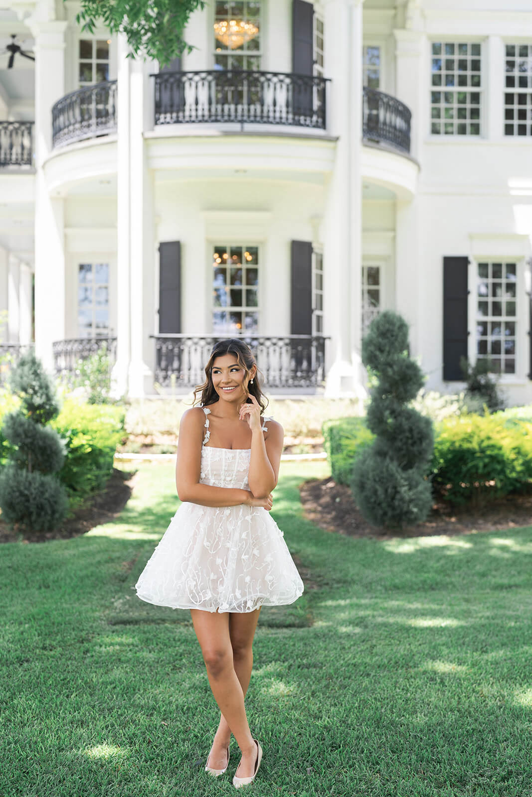 bride poses in a white dress at Sandlewood Manor in Houston Texas by Swish and Click Photography