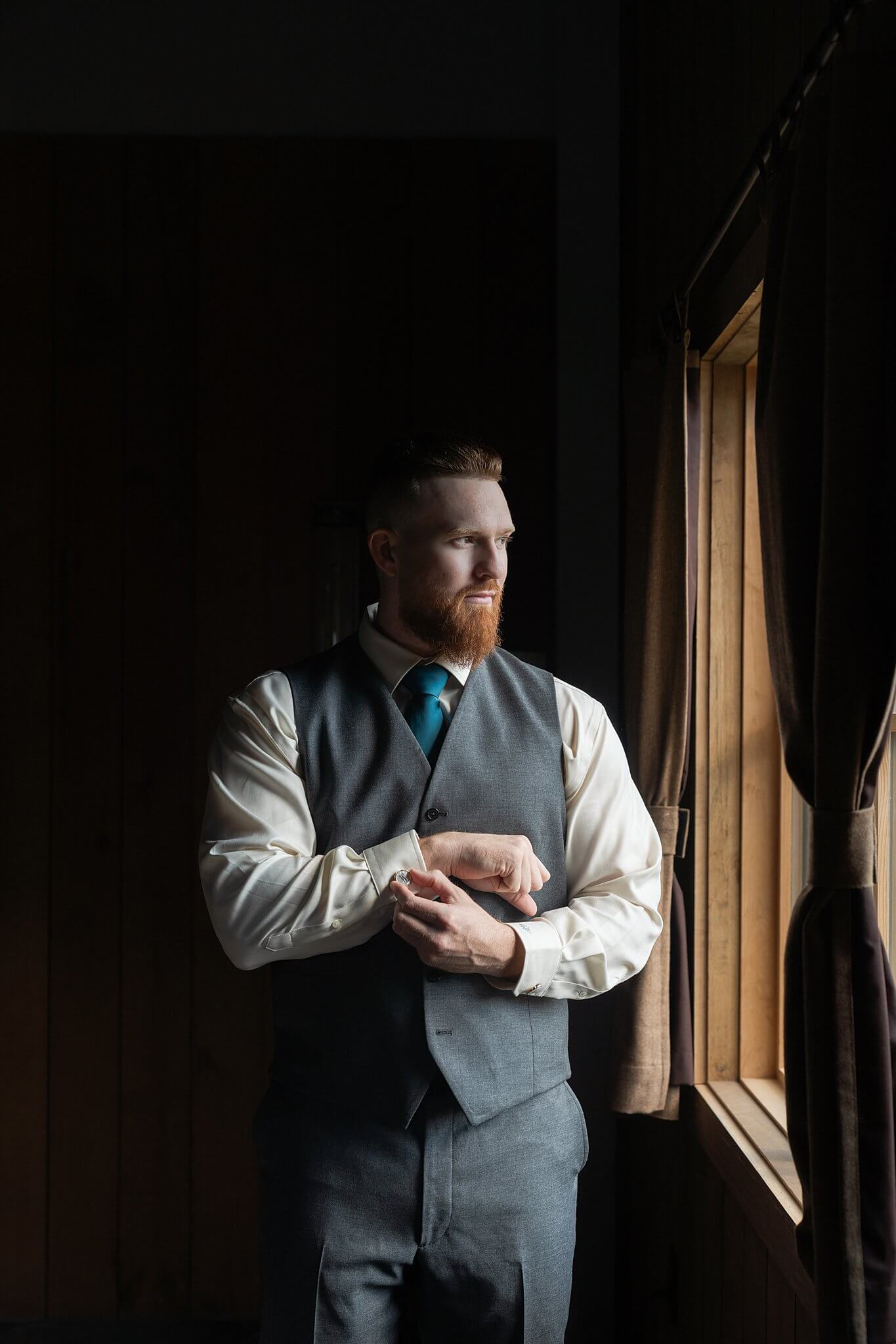Groom gets dressed on his wedding day captured by Houston's Swish and Click Photography at the Blue Magnolia