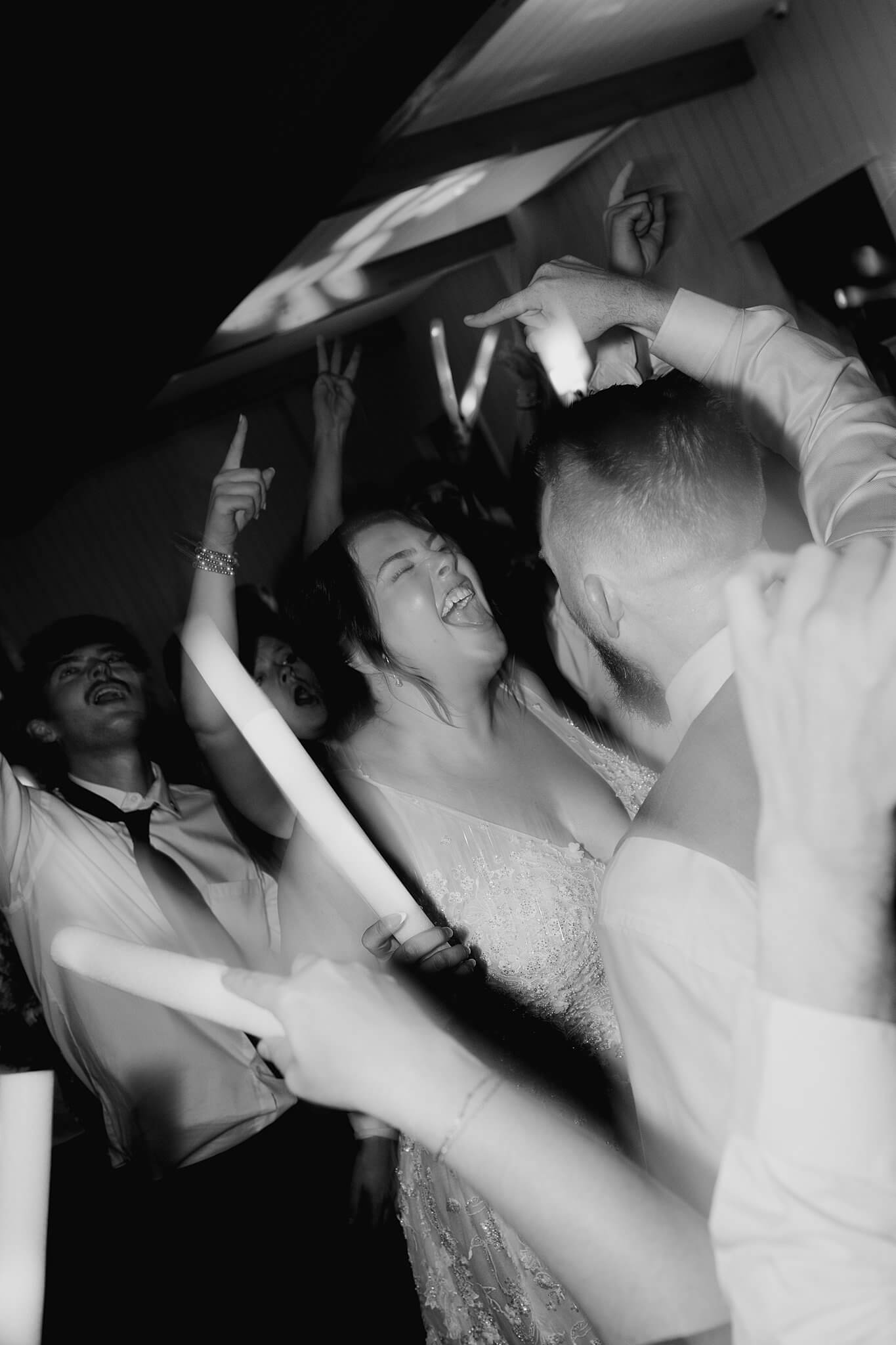 bride and groom rave during their wedding reception at wedding venue the Blue Magnolia by Swish and Click Photography