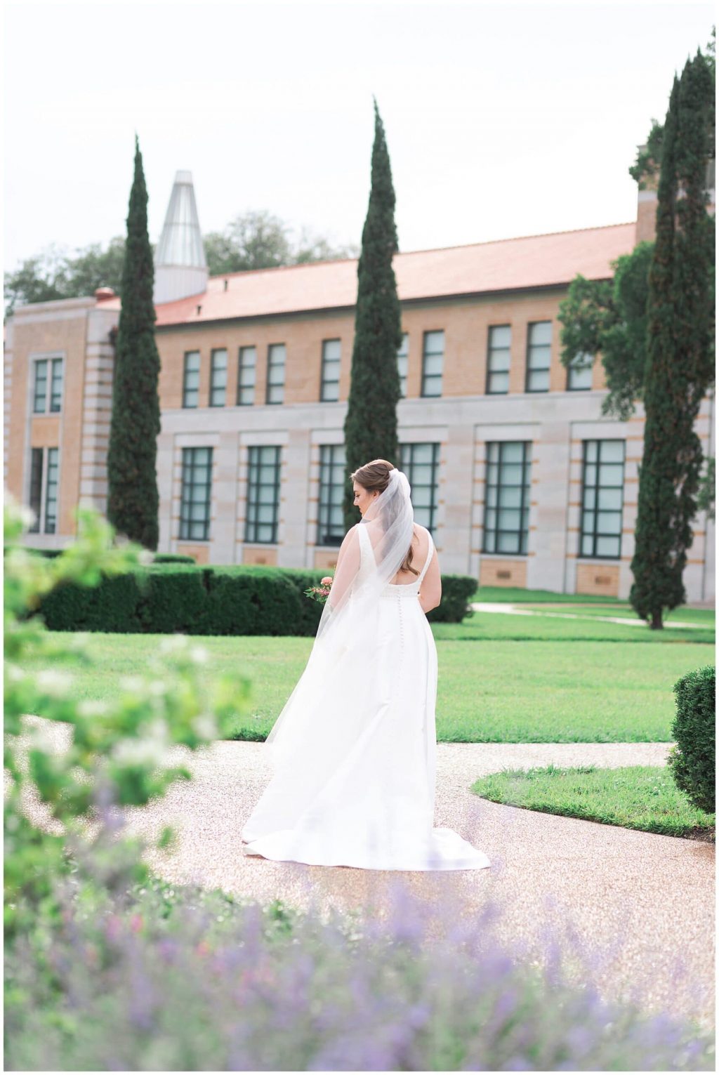 Houston bride poses at Rice University in Houston Texas by Swish and Click Photography